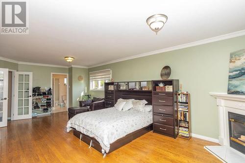 225 Woodward Avenue, Blind River, ON - Indoor Photo Showing Bedroom With Fireplace