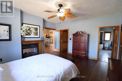 6509 Highway 11 N, North Bay, ON - Indoor Photo Showing Bedroom With Fireplace