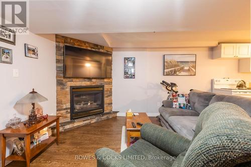2 Armour Court, Kawartha Lakes, ON - Indoor Photo Showing Living Room With Fireplace