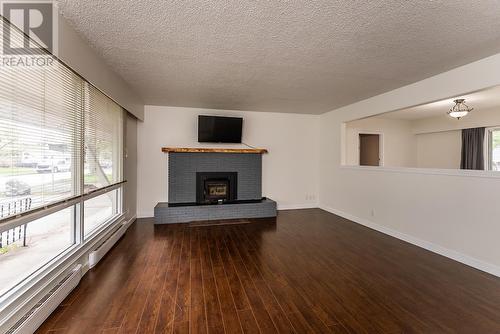 1645 Harper Drive, Prince George, BC - Indoor Photo Showing Living Room With Fireplace