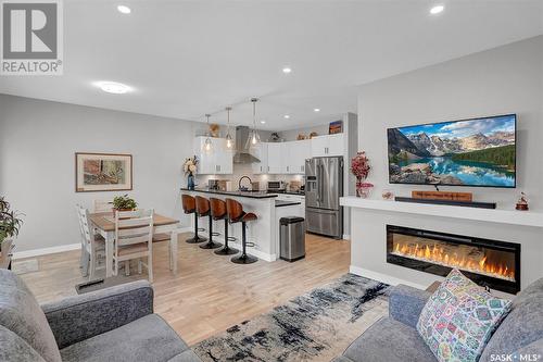 105 3121 Green Bank Road, Regina, SK - Indoor Photo Showing Living Room With Fireplace