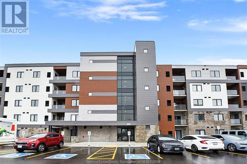 2550 Sandwich West Parkway Unit# 206, Lasalle, ON - Outdoor With Balcony With Facade