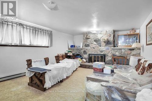 14482 Eight Mile Road, Middlesex Centre (Arva), ON - Indoor Photo Showing Living Room With Fireplace