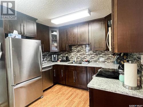 419 7Th Street W, Meadow Lake, SK - Indoor Photo Showing Kitchen With Stainless Steel Kitchen With Double Sink With Upgraded Kitchen