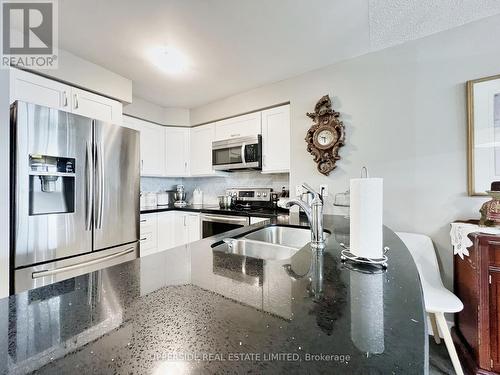 309 - 60 Brian Harrison Way, Toronto (Bendale), ON - Indoor Photo Showing Kitchen With Double Sink With Upgraded Kitchen