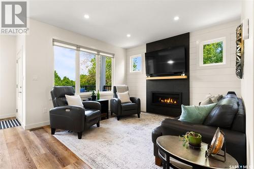 113 Green Avenue, Regina Beach, SK - Indoor Photo Showing Living Room With Fireplace