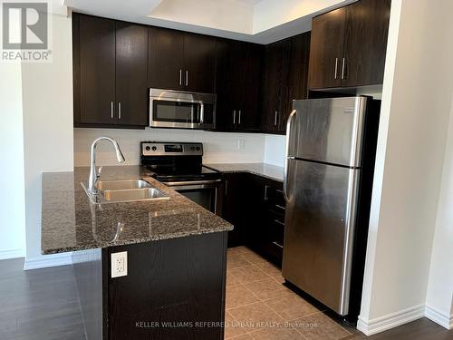 611 - 15 James Finlay Way, Toronto (Downsview-Roding-Cfb), ON - Indoor Photo Showing Kitchen With Stainless Steel Kitchen With Double Sink With Upgraded Kitchen