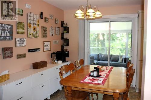 Dining area with patio doors to sunroom - 95 Algonquin Avenue, Long Sault, ON - Indoor Photo Showing Dining Room