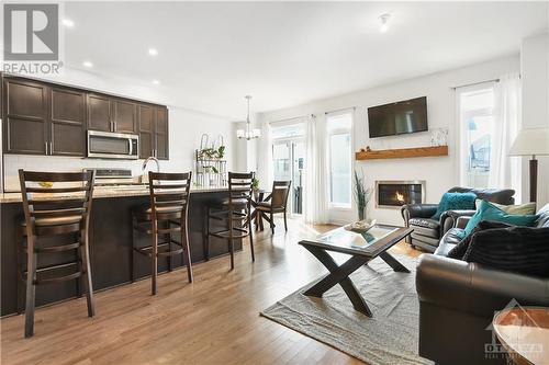 Lots of light and a fireplace! - 852 Clapham Terrace, Stittsville, ON - Indoor Photo Showing Living Room With Fireplace