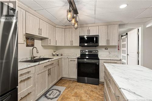 103 Rachel Street, Shediac, NB - Indoor Photo Showing Kitchen With Double Sink