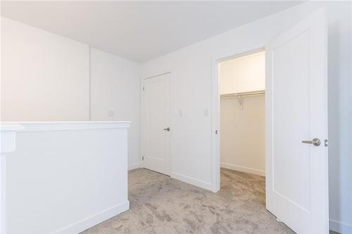 Second Floor - Landing, Closet and Laundry - 4263 Fourth Avenue|Unit #821, Niagara Falls, ON - Indoor Photo Showing Other Room