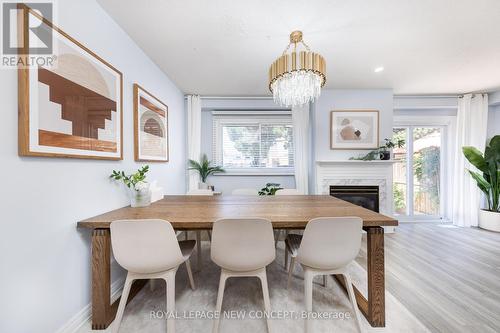 52 - 5033 Pinedale Avenue, Burlington (Appleby), ON - Indoor Photo Showing Dining Room With Fireplace