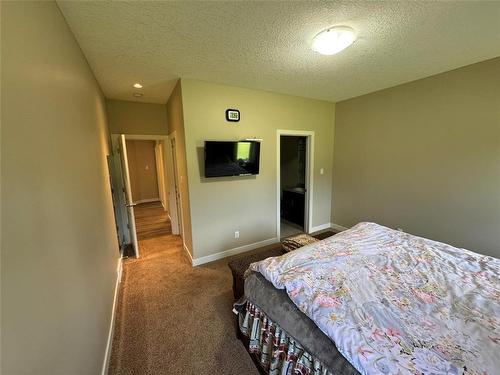 1 18 Outback Drive, Brandon, MB - Indoor Photo Showing Bedroom