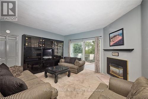 84 Merritt Street, St. Catharines, ON - Indoor Photo Showing Living Room With Fireplace