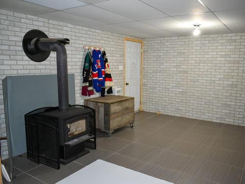 Family room - 1450 Rue John-Carey, Drummondville, QC - Indoor Photo Showing Other Room With Fireplace