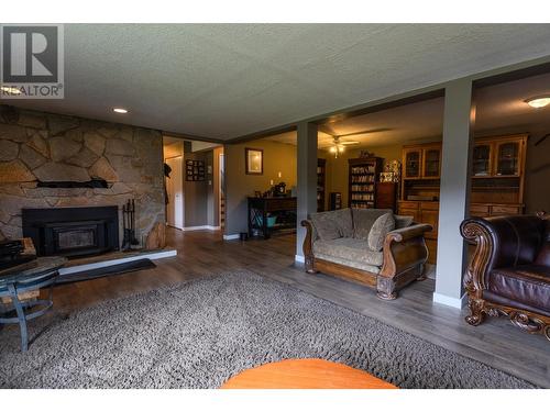 8716 Westsyde Road, Kamloops, BC - Indoor Photo Showing Living Room With Fireplace