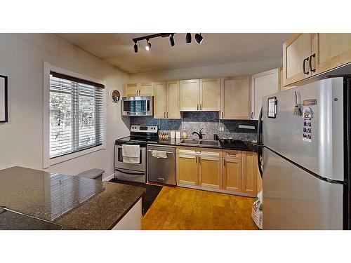 7 - 1691 Highway 3A, Nelson, BC - Indoor Photo Showing Kitchen With Stainless Steel Kitchen
