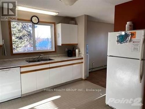 A & B - 29 Keg Road, Rainbow Lake, AB - Indoor Photo Showing Kitchen With Double Sink