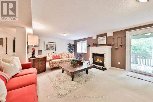 11 - 1010 Cristina Court N, Mississauga, ON - Indoor Photo Showing Living Room With Fireplace