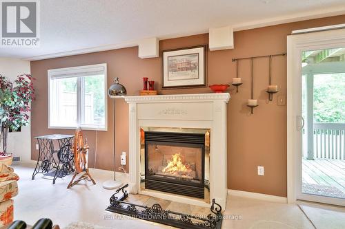 11 - 1010 Cristina Court N, Mississauga, ON - Indoor Photo Showing Living Room With Fireplace