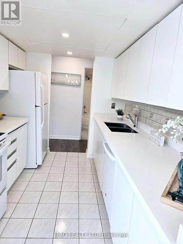 306 - 5 Rowntree Road S, Toronto, ON - Indoor Photo Showing Kitchen With Double Sink