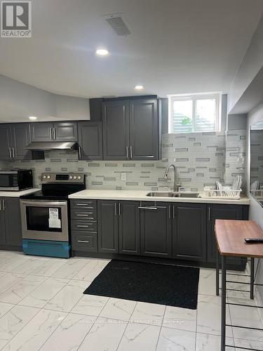 Bsmt - 12 Yellowknife Road, Brampton, ON - Indoor Photo Showing Kitchen With Double Sink