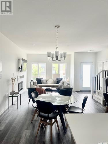 5206 Squires Road, Regina, SK - Indoor Photo Showing Dining Room With Fireplace