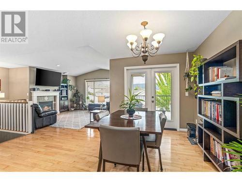 1492 Longley Crescent, Kelowna, BC - Indoor Photo Showing Dining Room With Fireplace