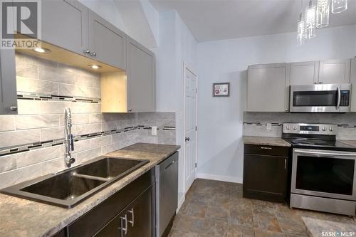 1159 Alder Avenue, Moose Jaw, SK - Indoor Photo Showing Kitchen With Double Sink