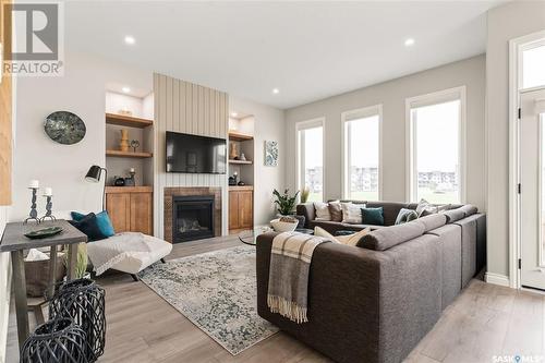 5201 Green Crescent, Regina, SK - Indoor Photo Showing Living Room With Fireplace