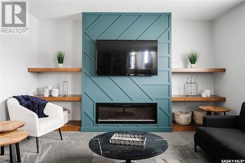 5201 Green Crescent, Regina, SK - Indoor Photo Showing Living Room With Fireplace