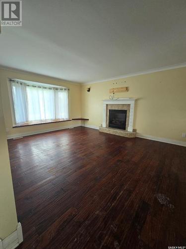 103 Joyce Drive, Oxbow, SK - Indoor Photo Showing Living Room With Fireplace