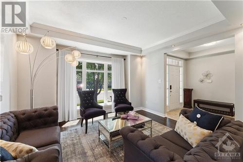 Spacious living room with gleaming hardwood floors and large front window - 284 Calaveras Avenue, Ottawa, ON - Indoor Photo Showing Living Room