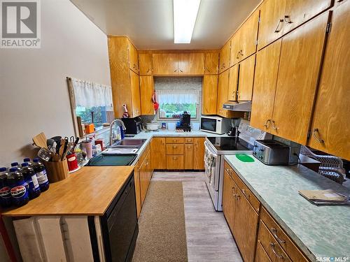 210 1St Street W, Frontier, SK - Indoor Photo Showing Kitchen With Double Sink