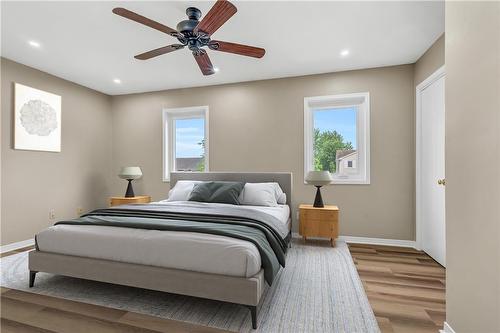 Master Bedroom Virtually Stagged - 5763 Hemlock Street, Niagara Falls, ON - Indoor Photo Showing Bedroom