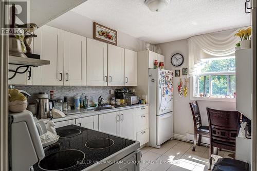 309 - 700 Dynes Road, Burlington (Roseland), ON - Indoor Photo Showing Kitchen With Double Sink