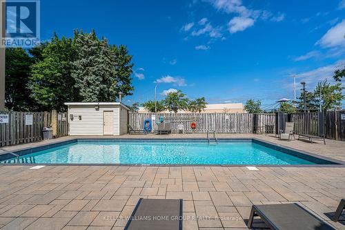 309 - 700 Dynes Road, Burlington (Roseland), ON - Outdoor With In Ground Pool