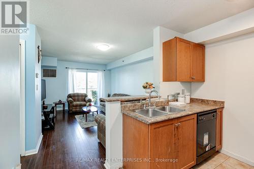 407 - 5225 Finch Avenue E, Toronto E07, ON - Indoor Photo Showing Kitchen With Double Sink