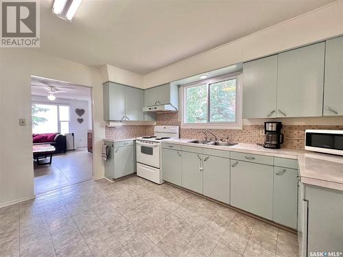 210 Ruby Drive, Hitchcock Bay, SK - Indoor Photo Showing Kitchen With Double Sink