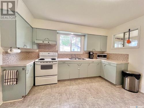 210 Ruby Drive, Hitchcock Bay, SK - Indoor Photo Showing Kitchen With Double Sink