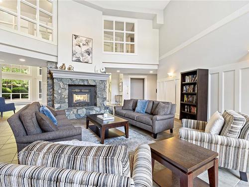 105-5650 Edgewater Lane, Nanaimo, BC - Indoor Photo Showing Living Room With Fireplace