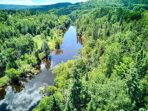 Photo aÃ©rienne - 166 Ch. De La Falaise, Piedmont, QC - Outdoor With Body Of Water With View