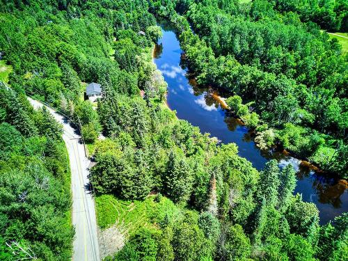 Photo aÃ©rienne - 166 Ch. De La Falaise, Piedmont, QC - Outdoor With Body Of Water