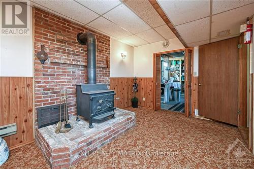 12646 County 28 Road, South Dundas, ON - Indoor Photo Showing Other Room With Fireplace