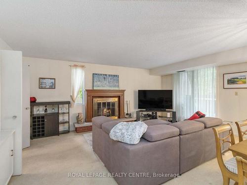 18-1330 Mississauga Valley Blvd, Mississauga, ON - Indoor Photo Showing Living Room With Fireplace