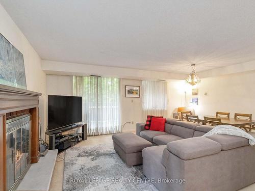 18-1330 Mississauga Valley Blvd, Mississauga, ON - Indoor Photo Showing Living Room With Fireplace