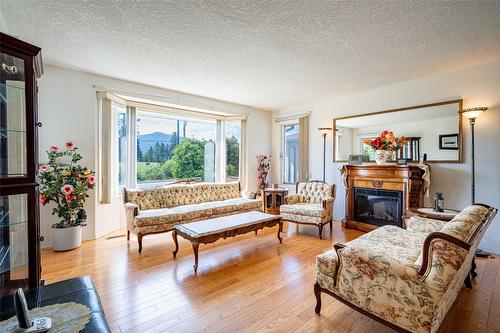 2076 Okanagan Street, Armstrong, BC - Indoor Photo Showing Living Room With Fireplace