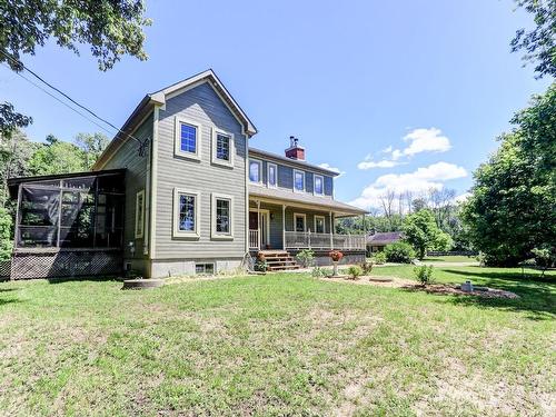 Back facade - 341 Route Du Long-Sault, Saint-André-D'Argenteuil, QC - Outdoor With Deck Patio Veranda