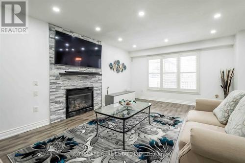 19 Staples Lane, Hamilton (Binbrook), ON - Indoor Photo Showing Living Room With Fireplace