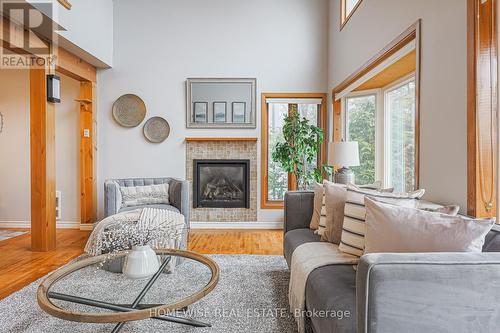 128 Moores Beach Road, Georgina (Virginia), ON - Indoor Photo Showing Living Room With Fireplace